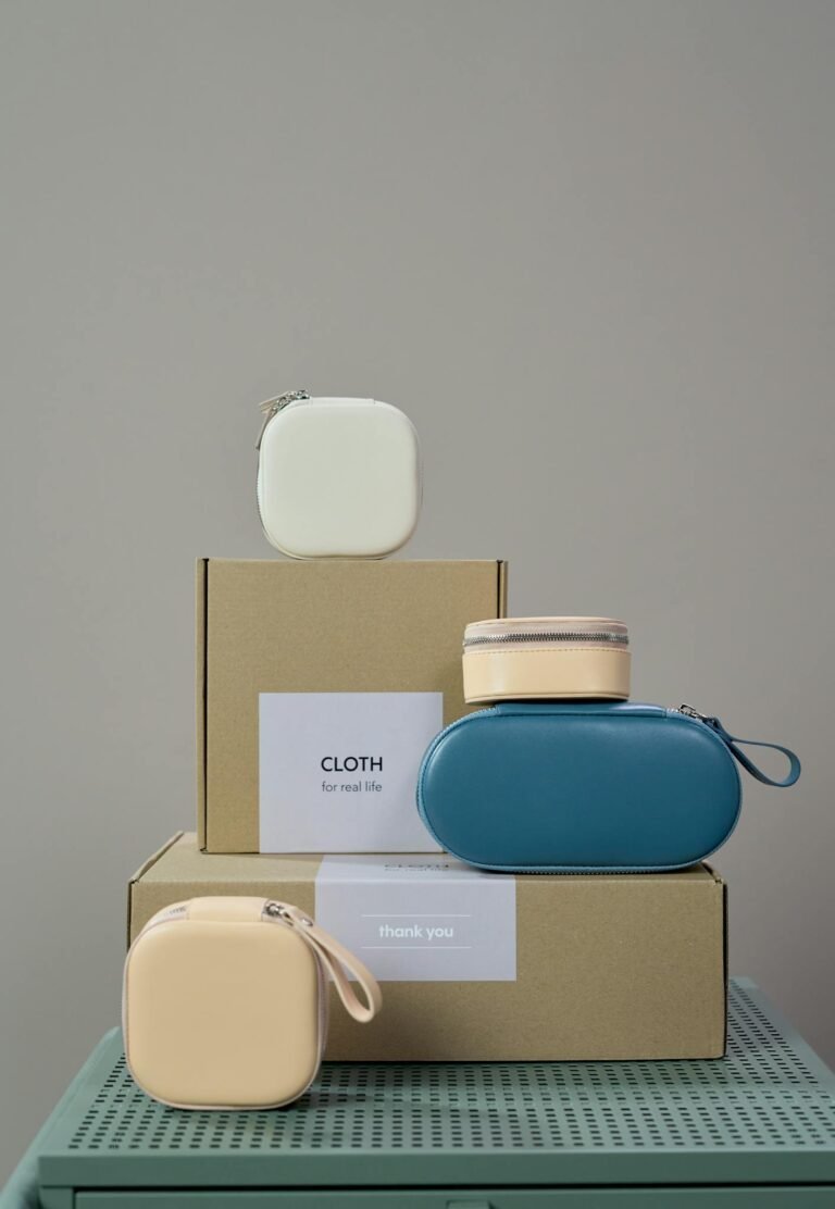 Elegant stack of cardboard boxes with stylish pouches for a minimalist product showcase.